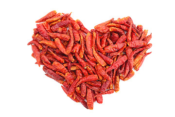 Image showing Spicy red birds eye chilli peppers in a heart shape