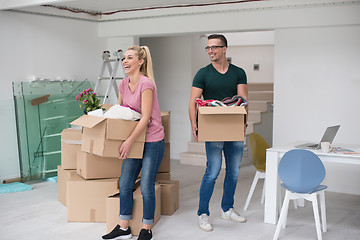 Image showing young couple moving into a new home