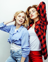 Image showing best friends teenage girls together having fun, posing emotional on white background, besties happy smiling, lifestyle people concept close up. making selfie