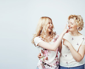 Image showing mother with daughter together posing happy smiling isolated on white background with copyspace, lifestyle people concept 