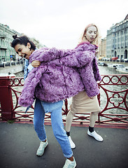 Image showing Two teenage girls infront of university building smiling, having