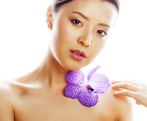 Image showing young pretty asian woman with flower purple orchid close up isol