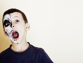 Image showing little cute boy with facepaint like skeleton to celebrate hallow