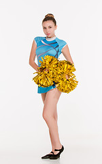 Image showing The teen cheerleader posing at white studio