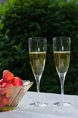 Image showing Two glasses with sparkling wine and strawberries