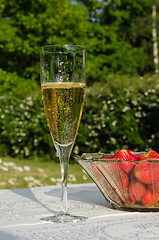 Image showing Glass of bubble and strawberries