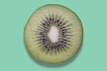 Image showing Piece of kiwi on colorful background