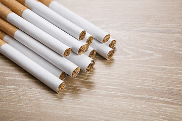 Image showing Cigarettes on brown background