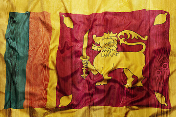 Image showing National flag of Sri Lanka, wooden background