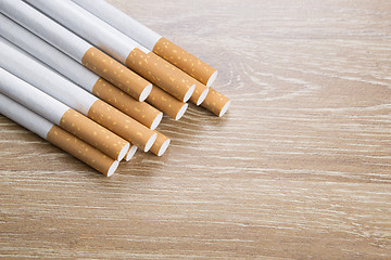 Image showing Cigarettes on brown background