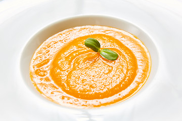 Image showing The organic pumpkin soup. Top view. Vegetarian food.