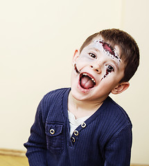 Image showing little cute boy with facepaint like skeleton to celebrate hallow