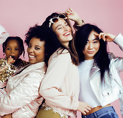 Image showing Lifestyle and people concept: young pretty diversity nations woman with different age children celebrating on birth day party together happy smiling, making selfie. African-american, asian and caucasi