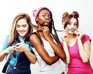 Image showing diverse multi nation girls group, teenage friends company cheerful having fun, happy smiling, cute posing isolated on white background, lifestyle people concept, african-american and caucasian 