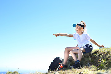 Image showing Mountain expedition. Resting on the trail of a mountain expedition.