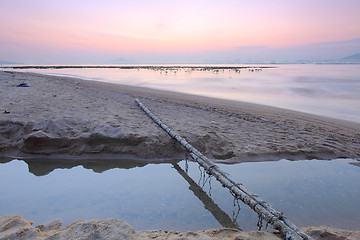 Image showing Tropical sunset on the beach.