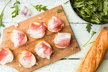 Image showing Bacon with white bread ,arugula ,