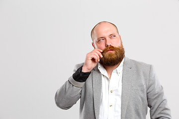 Image showing Pensive man with mustache, beard ,