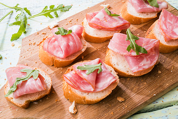 Image showing Baguette with ham and greens