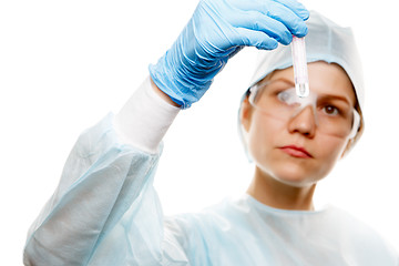 Image showing Doctor looks at test tube