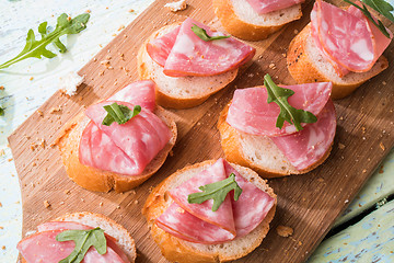 Image showing Bread with ham and arugula