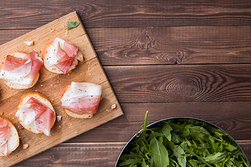 Image showing Bread and bacon ,brown table