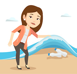 Image showing Woman showing plastic bottles under sea wave.