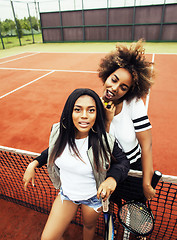 Image showing young pretty girlfriends hanging on tennis court, fashion stylis