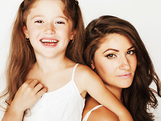 Image showing young mother with little cute daughter emotional posing on white