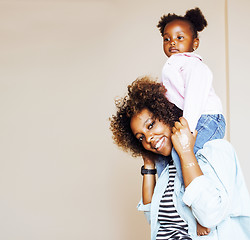 Image showing adorable sweet young afro-american mother with cute little daugh