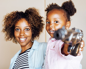 Image showing adorable sweet young afro-american mother with cute little daugh