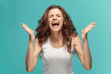 Image showing Portrait of young woman with shocked facial expression