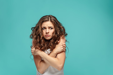 Image showing The young woman\'s portrait with thoughtful emotions