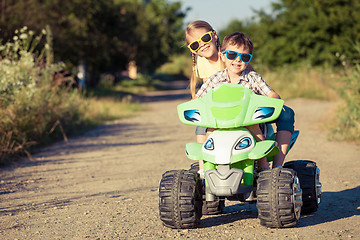 Image showing Happy children playing on the road at the day time.