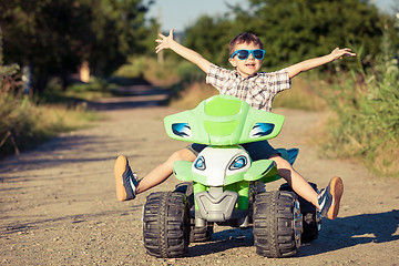 Image showing Happy little boy playing on road at the day time.