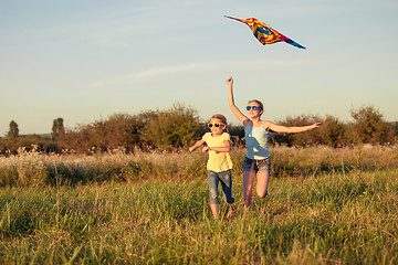 Image showing Happy children playing on the field at the day time.