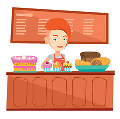 Image showing Worker standing behind the counter at the bakery.