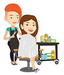 Image showing Hairdresser making haircut to young woman.