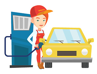 Image showing Worker filling up fuel into car.