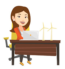 Image showing Woman working with model of wind turbines.