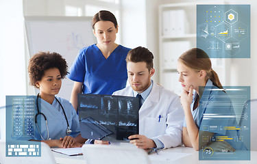 Image showing group of doctors discussing x-ray scan at hospital