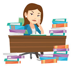 Image showing Student sitting at the table with piles of books.