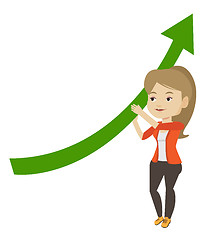 Image showing Business woman holding arrow going up.