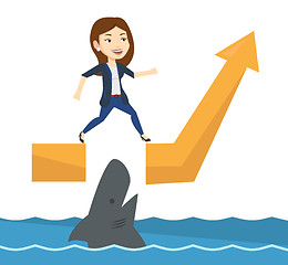 Image showing Business woman jumping over ocean with shark.