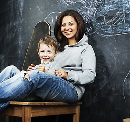 Image showing young hipster teenage girl sitting with her brother in classroom