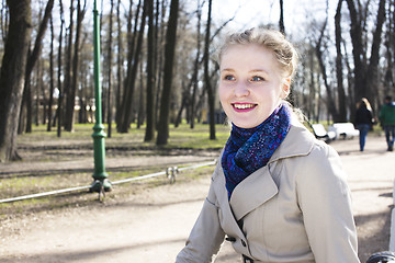 Image showing young pretty blonde girl enjoing spring nature in park, lifestyle people concept 