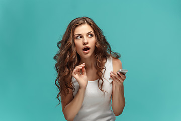 Image showing Portrait of young woman with shocked facial expression