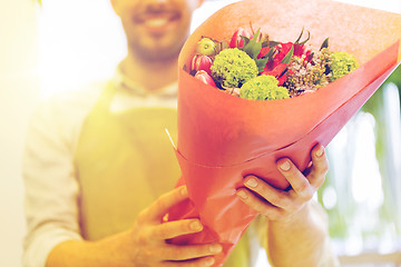 Image showing close up of florist with bunch at flower shop