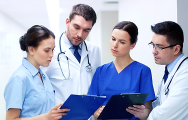 Image showing group of medics at hospital with clipboard