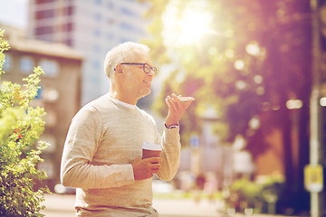 Image showing old man using voice command recorder on smartphone